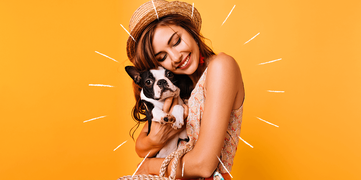 Girl holding dog